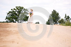 Women on country road with flowers