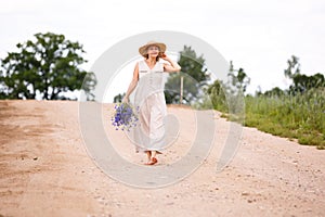 Women on country road with flowers