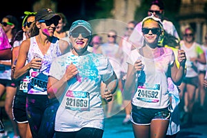 Women couple runs the Color Vibe 5K race