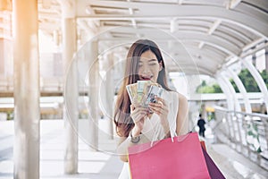 Women crazy shopaholic holding shopping bags , money ,credit card person at shopping malls.Fashionable Woman love online website