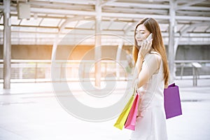 Women crazy shopaholic holding shopping bags , money ,credit card person at shopping malls.Fashionable Woman love online website