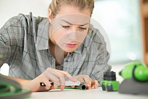 women cutting pvc pipe