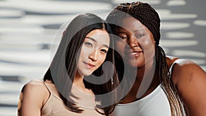 Women with different body types posing in studio