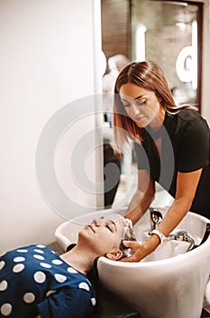 Women discussing beauty products in salon