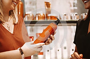 Women discussing beauty products in salon