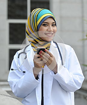 Women Doctor use smart phone