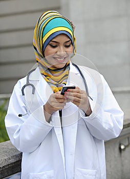 Women Doctor use smart phone