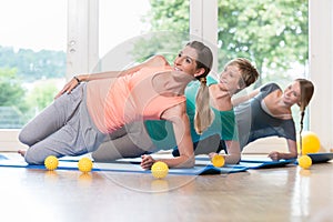 Women doing exercises for pelvis floor in postnatal regression c photo
