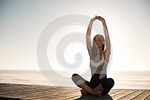 Women doing pilates on the beach