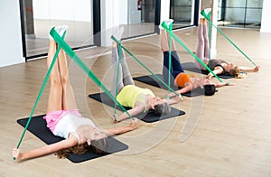 Women doing stretches with resistance bands
