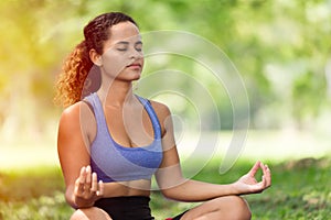 Women doing yoga concentration for mental health meditation outdoor park girl black Caucasian race