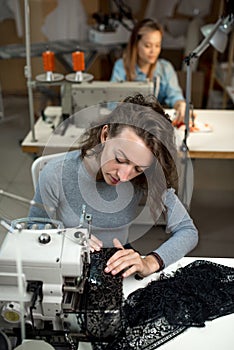 Women dressmakers work on sewing machines