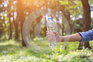 Women drink water in beautiful natural forests.