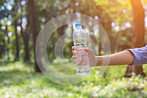 Women drink water in beautiful natural forests.