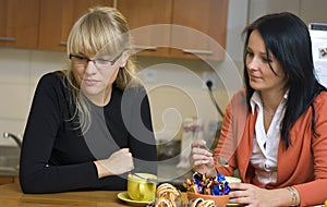 Women drinking coffee at home photo
