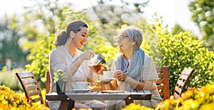 women drinking tea in the garden