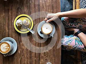 Women eating cupcakes coffee in breakfast food