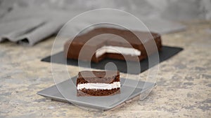 Women eating homemade piece of chocolate cake.