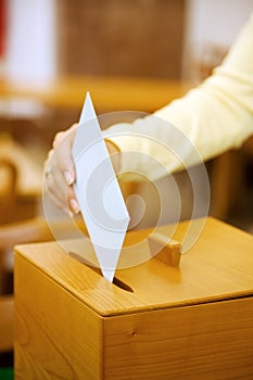 Women in the election with ballots and ballot box