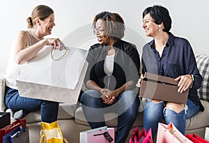 Women enjoy shopping and carrying bags