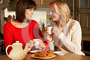 Women Enjoying Tea And Cake Together
