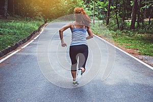 Women exercise on the street. Nature park. Girl who is lifting legs to exercise. exercise, running, Girl who is running jogging