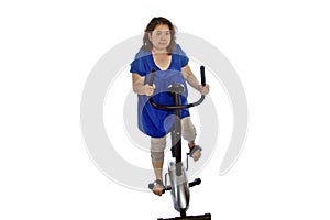 Women are exercising by cycling,