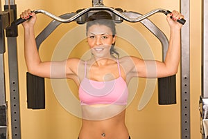 Women exercising on weightlifting machine