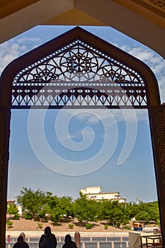 Women exiting ornate walkway at mosque