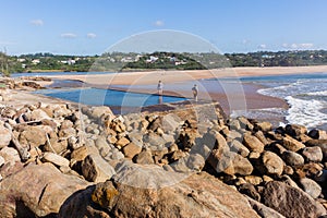 Women Exploring Beach Tidal Pool