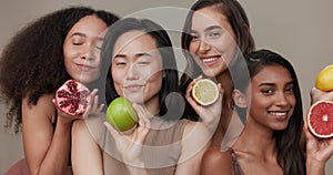 Women, face and beauty, diversity and fruit with dermatology and friends on studio background. Unique skin, natural