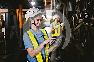 Women in factory engineer working using tablet computer