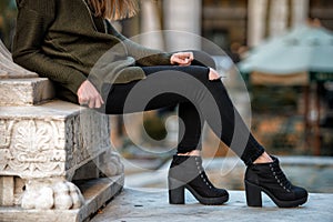 Women fall wear street style with black pants and sweater photo