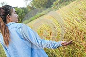 Women farmer in ripe wheat field