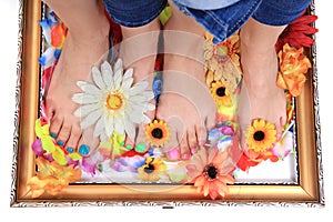 women feets and flowers (pedicure tbackground)