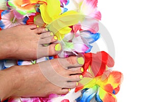 Women feets and flowers (pedicure tbackground)