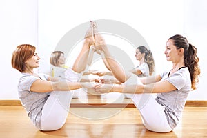 Women finding body balance throw a phisical exercise