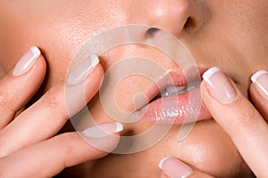 Women fingers with acrylic fingernail photo