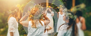 Women in flower wreath on sunny meadow, Floral crown, symbol of summer solstice.