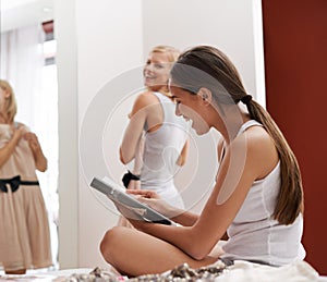 Women, friends and dress in bedroom, laugh and mirror at home for style and beauty. Female, smile and fashion to show