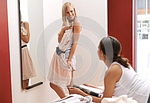Women, friends and fashion in bedroom, choice and mirror at home for style and beauty. Female, smile and dress to show