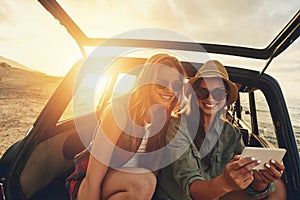 Women friends, selfie and car on vacation, beach and sunset on social media app with smile by waves. Woman, smartphone