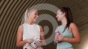 Women or friends with skipping rope and bottle