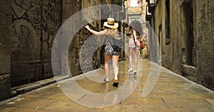 Women, friends and tourist in city, excited and skipping on walk, funny and together on adventure in Spain. Girl, people