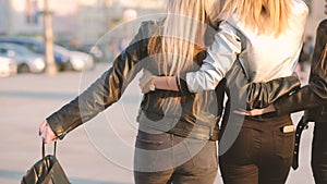 Women friendship happy besties walking city street