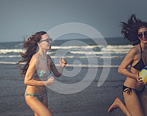 Women Friendship Playing Volleyball Beach Summer