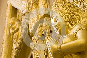 Women gold statue pray in temple. Ubonratchathani Thailand