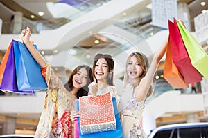 Women group Carrying Shopping Bags in mall