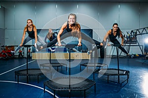 Women group on sport trampoline, fitness workout