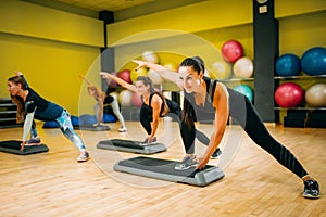 Women group on step aerobic training